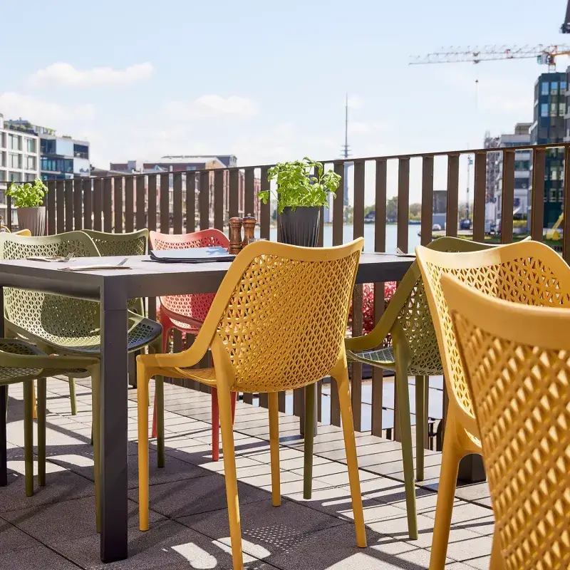 Siena Garden Urban Lights District Stapelsessel Polypropylen mustard Kostenloser Versand